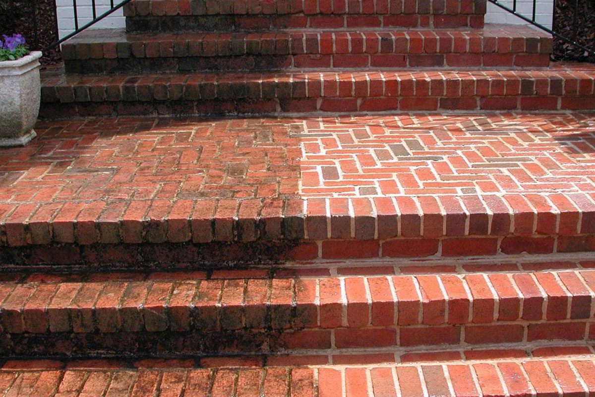 Before and after tuckpointing — brick steps restored with fresh mortar joints in St. Louis